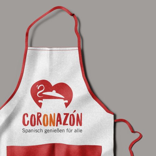 Logo CORONAZÓN, Spanisch genießen für alle, Herz mit mit Kochtopf auf Kochschürze